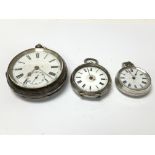 Three silver pocket watches of graduating sizes.