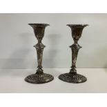 A pair of hallmarked silver candlesticks with mark