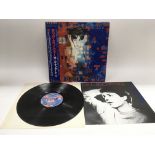 A Japanese import pressing of 'Tug Of War' by Paul McCartney. Complete with obi strip and inserts.