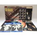 Three early UK pressings of Beatles LPs together with issues 4 and 11 of The Beatles Book Monthly