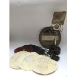 A collection of 1920s duophone unbreakable plastic records and a bakelite microphone etc. NO