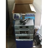 A boxed karaoke machine with CDs and manual. NO RESERVE.