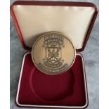 Bobby Moore Memorial Match Football Medal: Very large gold coloured medal with match details to