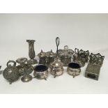 A silver condiment set cup holders a two section d