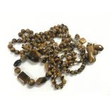 A collection of tiger's eye jewellery including pr