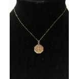 A 9ct gold pendant and chain, weighing in total ap