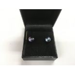 A pair of dark irridescent cultured pearl earrings