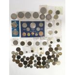 A collection of coins and tokens including various