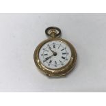 A 15 ct gold fob watch the enamel dial with Roman