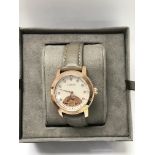 A boxed Clogau wrist watch with papers.