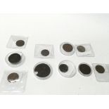 A collection of 9 tokens and coins.