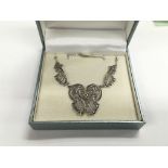 A silver marcasite necklace.