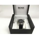 A boxed Boss gents dress watch.