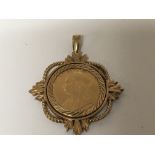 A 9carat gold pendent set with a Victorian half so