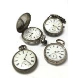 A collection of four silver pocket watches.