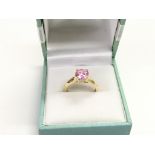 A 14k gold ring set with a pink stone, approx 2.5g