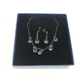 A vintage silver and crystal necklace and matching