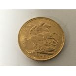 An Edward VII gold 1902 Sovereign.