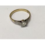 A 18 ct gold ring inset with single small diamond