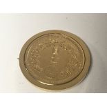 A rare Chinese gold coin circa 1914/15 set in a go