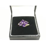 A 9ct gold ring set with amethyst, approx 2g and a