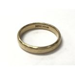 A 9ct gold plain band measuring approximate ring s