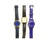Three watches comprising two Swatch watches and on