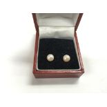 A pair of pearl stud earrings with 9ct gold clasps