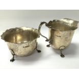 A small silver jug and silver bowl weighing in tot