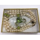 A synthetic pearl necklace and matching bracelet s