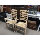 A pairvof lined oak ladder back open arm chairs wi