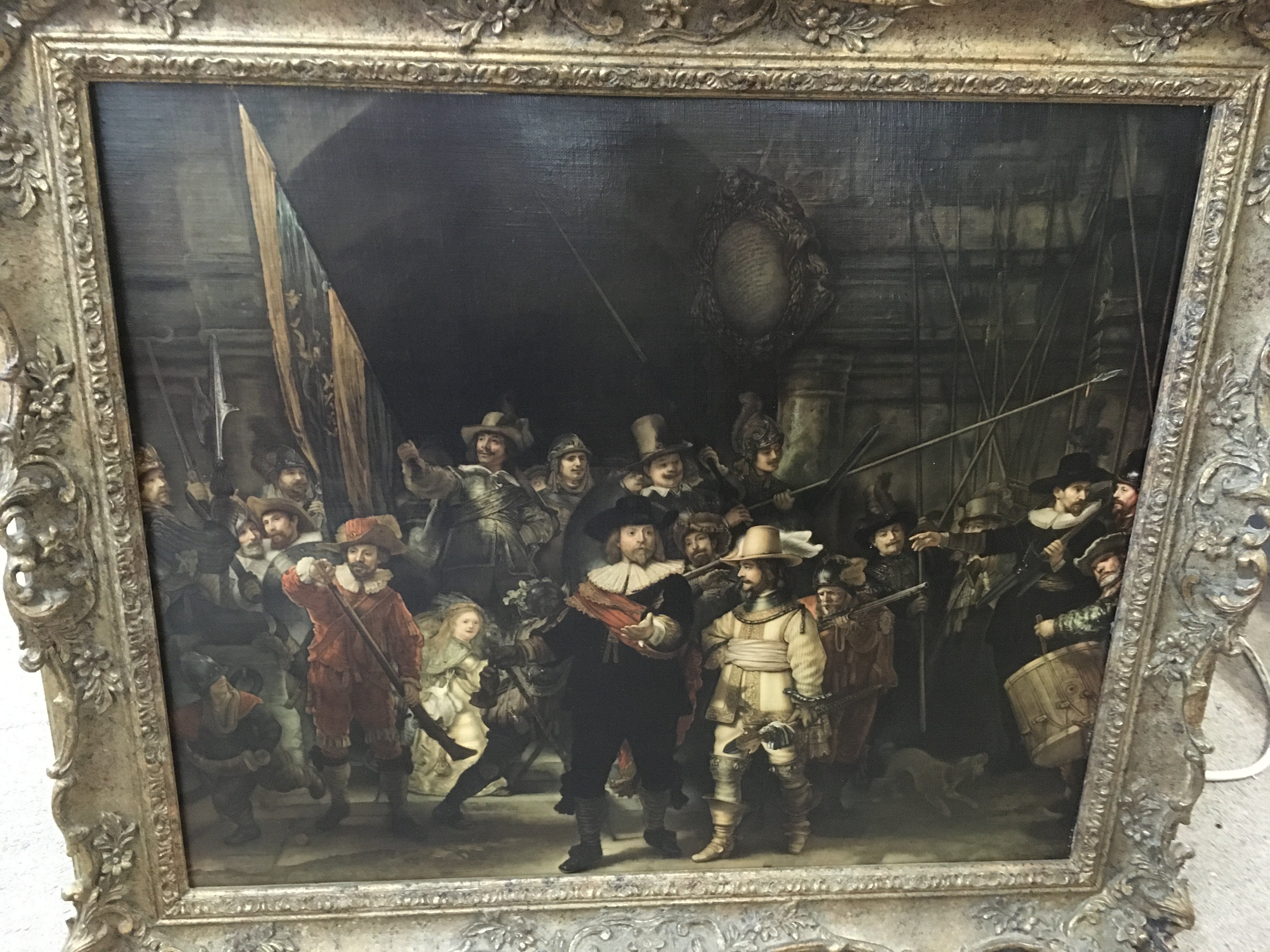 A gilt framed print of 17th Century figures about