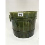 An Early 20th century green majolica bucket jardin