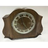 An Art Deco design walnut clock. With three train