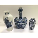 Three blue and white vases, largest approx 25cm.