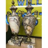 A pair of marble vases of classical form on square