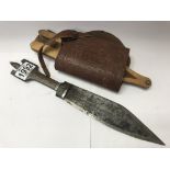 A North African knife with handle in leather sheat