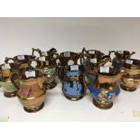 A collection of Victorian copper luster jugs with