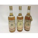 Three bottles of vintage Bells whisky Extra Specia