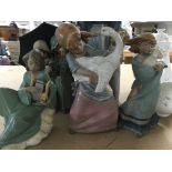 A collection of 21 Lladro figures including cherub