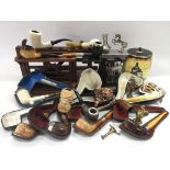 A collection of smoker's pipes, stands and tobacco