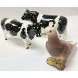 A matte Beswick racing pigeon and a Beswick cow an