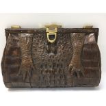 A crocodile leather clutch bag.