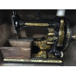 Sewing machines including cased ornate M A M and u