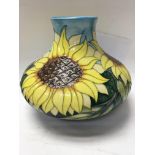 A Moorcroft vase decorated with sunflowers. 22 cm