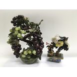 Two Chinese polished stone ornaments of fruit and