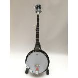 A five string banjo with compensated bridge and a