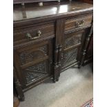 A Victorian mahogany cabinet fitted with two drawe