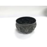 A white metal Indian bowl, approx diameter 10cm.