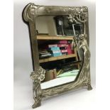 An Art Nouveau style table mirror decorated with a